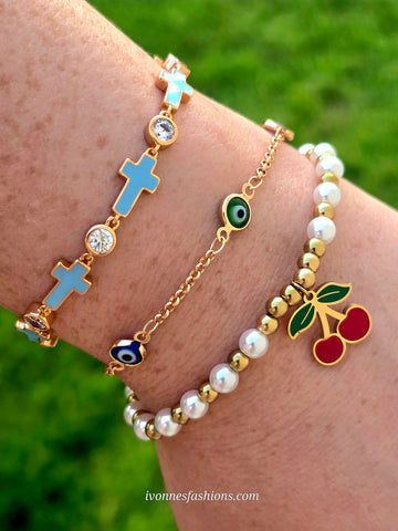 18k gold plated cross, evil eye and cherry bracelets